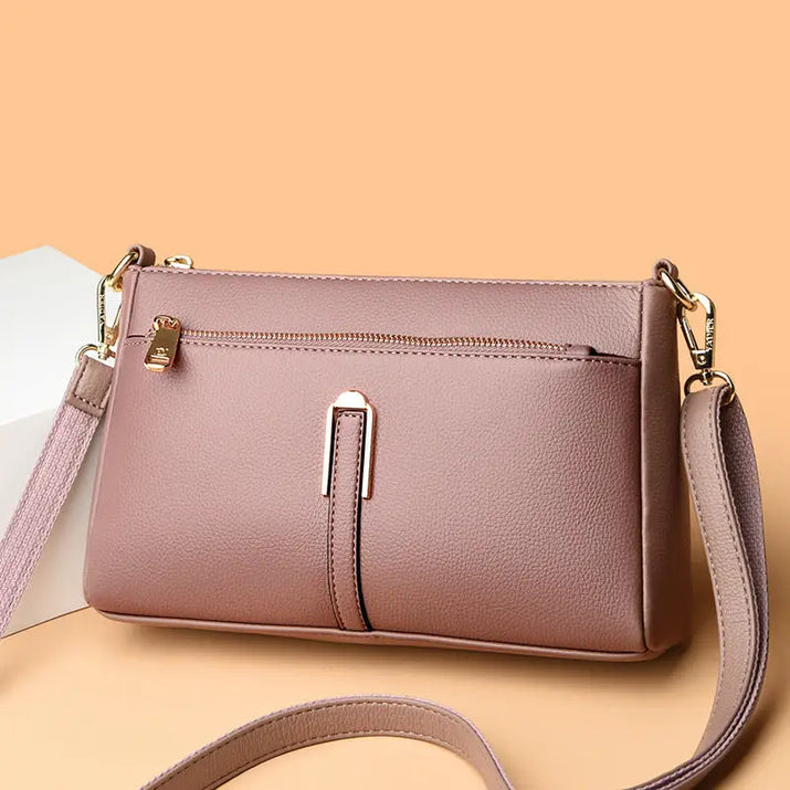 Mauve leather crossbody bag.