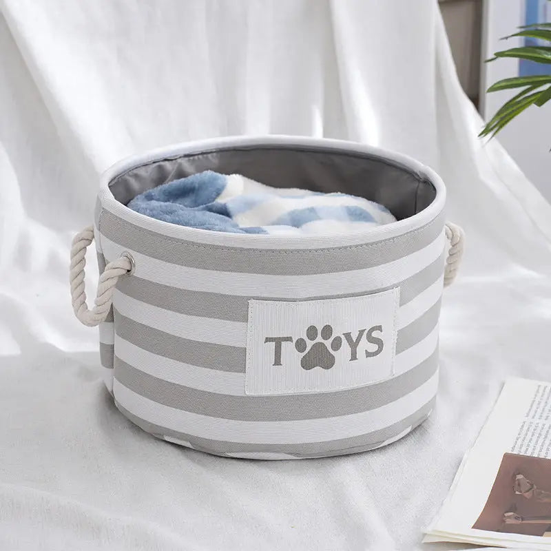 Striped toy storage bin.