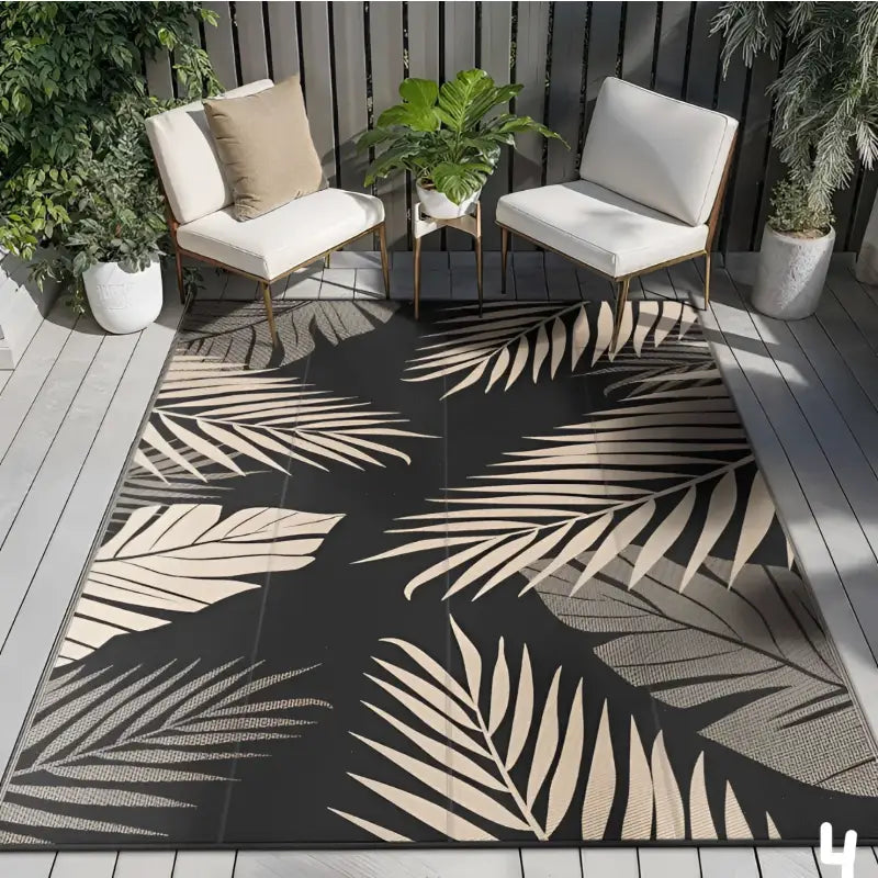 Black rug with palm leaf pattern.