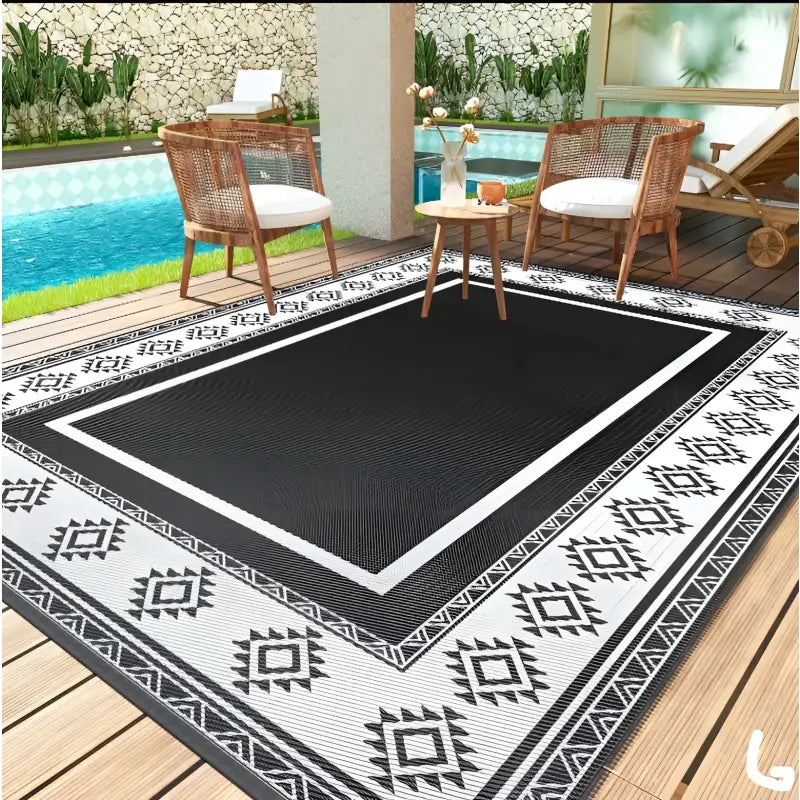 Black and white patterned outdoor rug.