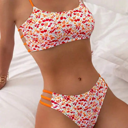 Floral print bikini with orange straps.