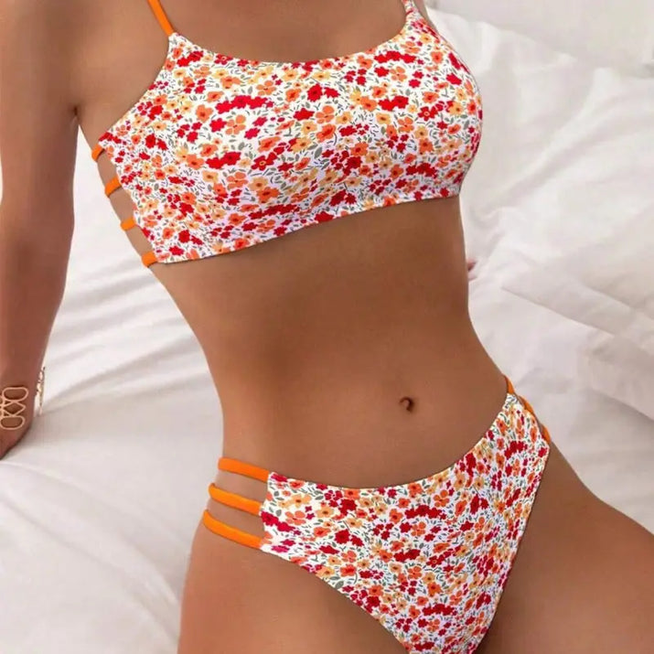 Floral print bikini with orange straps.