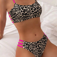 Leopard print bikini with pink straps.