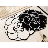 Black and white floral-shaped rugs.
