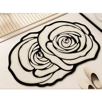 Rose-shaped rug with black outlines.