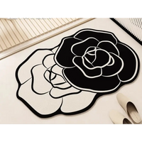 Black and white floral rug.