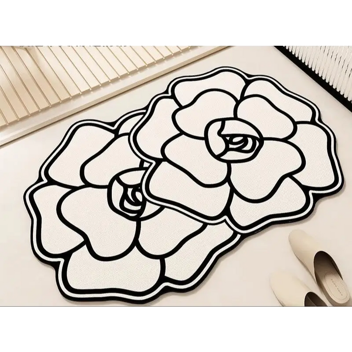 Floral-shaped, black and white rugs.