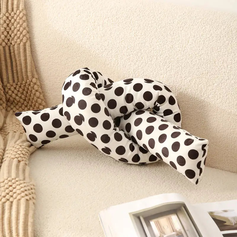Polka-dotted knot pillow.