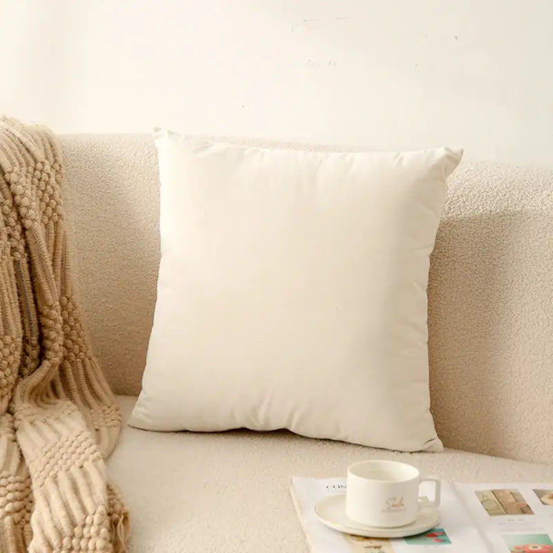 Square, off-white pillow.