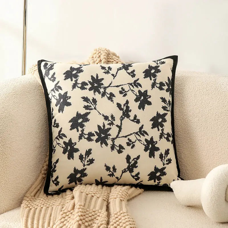Floral patterned throw pillow.