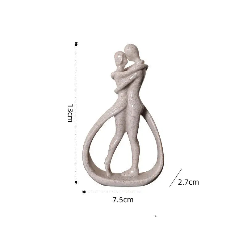 Abstract embracing couple sculpture.