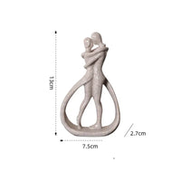 Abstract embracing couple sculpture.