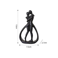 Abstract couple sculpture with dimensions.