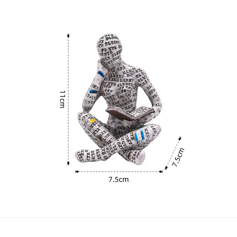 Figurine of a seated reader covered in text.