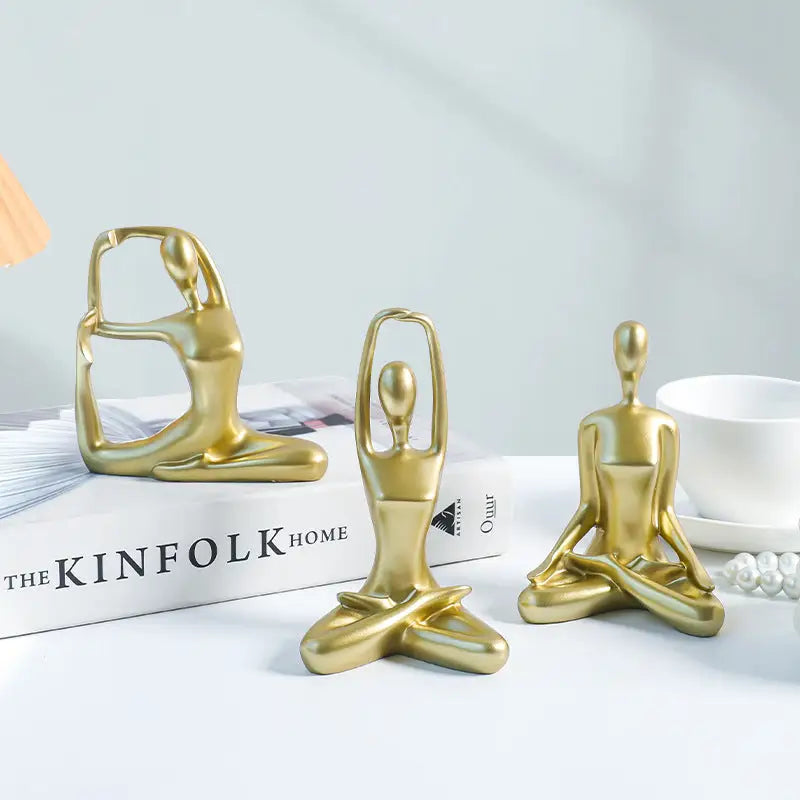 Golden yoga figurines.