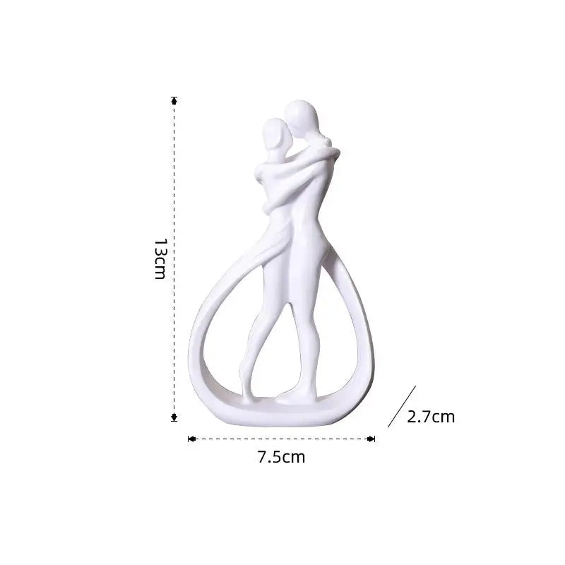 White hugging couple sculpture.