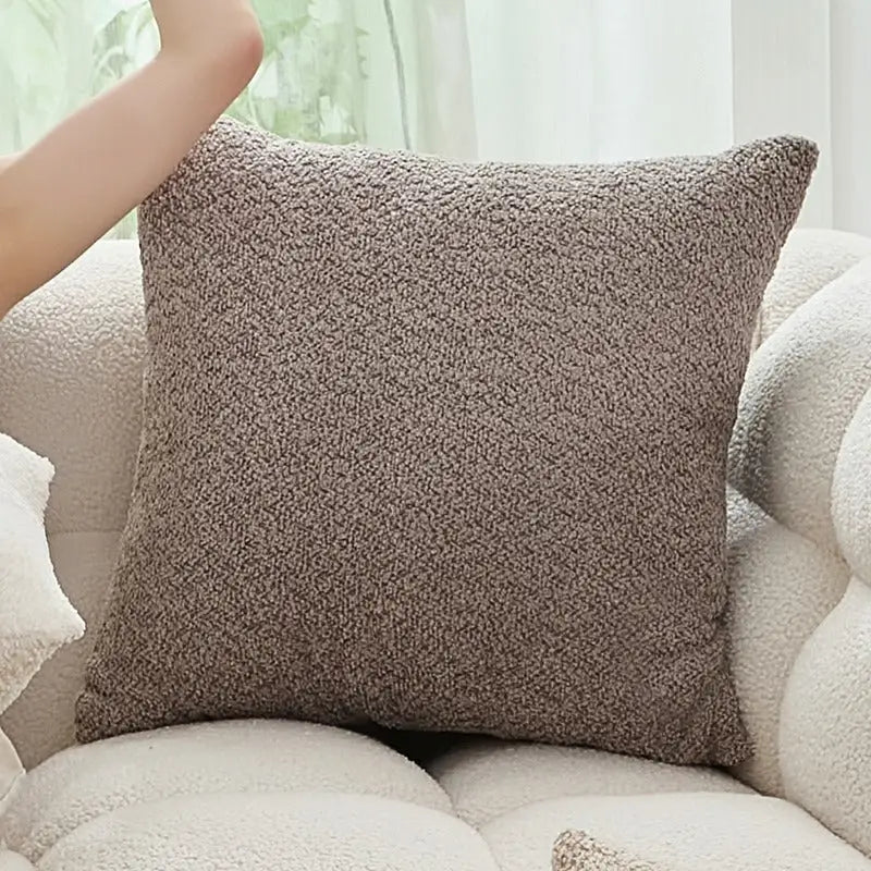 Textured brown throw pillow.