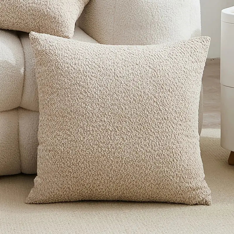 Textured beige throw pillow.