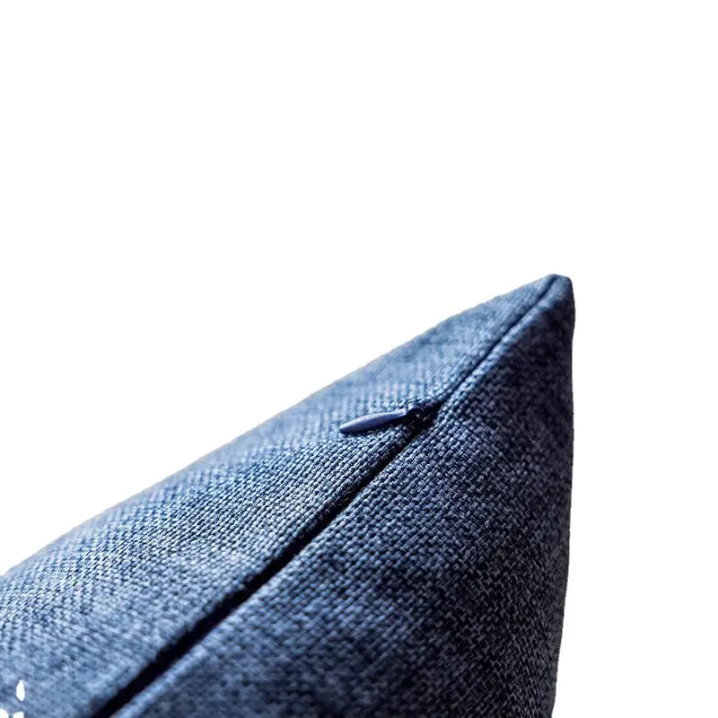 Blue textured pillow with zipper.