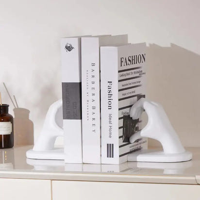 White hand-shaped bookends.