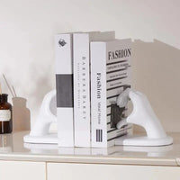 White hand-shaped bookends.