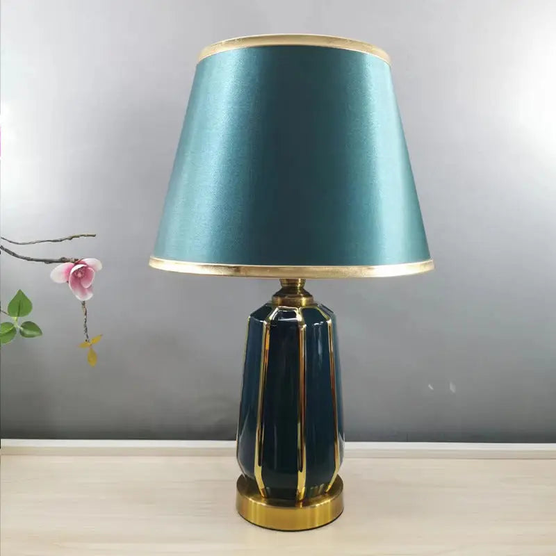 Teal and gold table lamp.