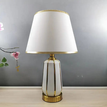 White and gold table lamp.