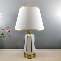 White and gold table lamp.