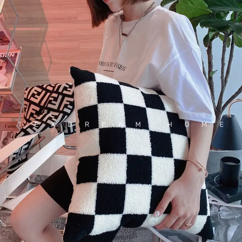 Black and white checkered pillow.