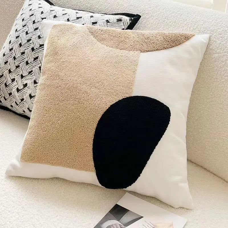Decorative pillow with geometric design.