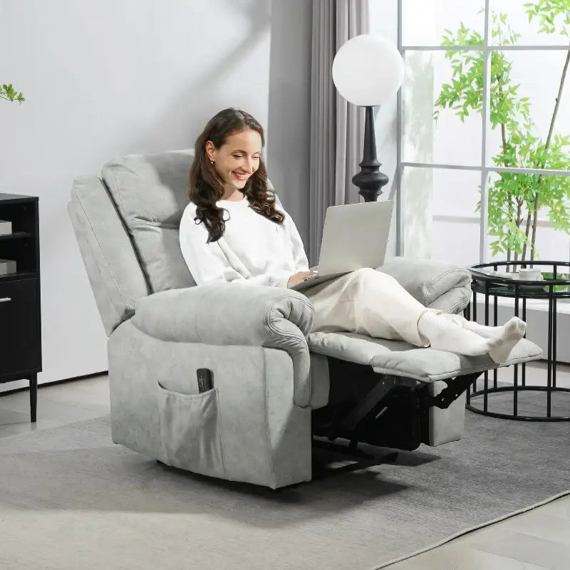 Gray recliner with extended footrest.