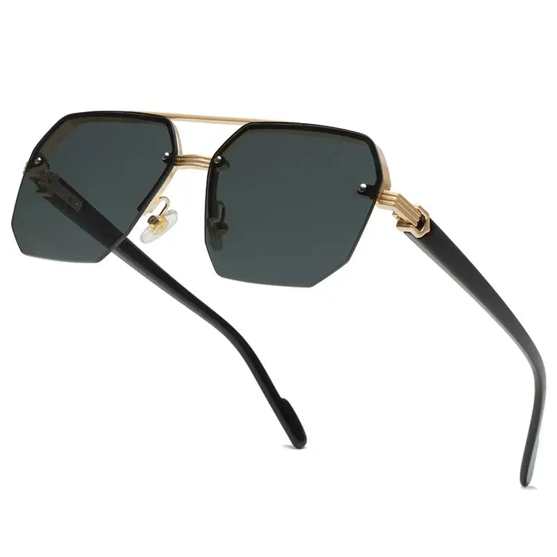 Rimless aviator sunglasses with gold accents.