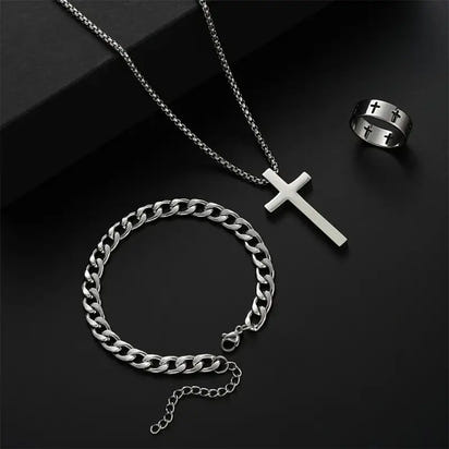 Silver cross necklace, chain bracelet, and cross ring.