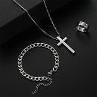 Silver cross necklace, chain bracelet, and cross ring.
