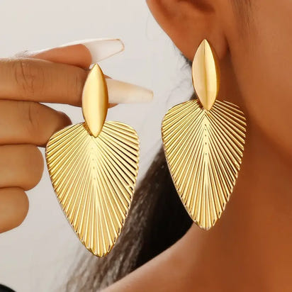 Gold leaf-shaped earrings.