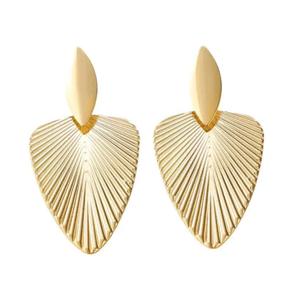 Pair of gold, ridged, heart-shaped earrings.