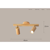 Wooden two-light spotlight fixture.