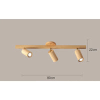 Wooden three-light ceiling fixture.