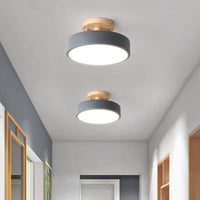 Two gray and wood ceiling lights.