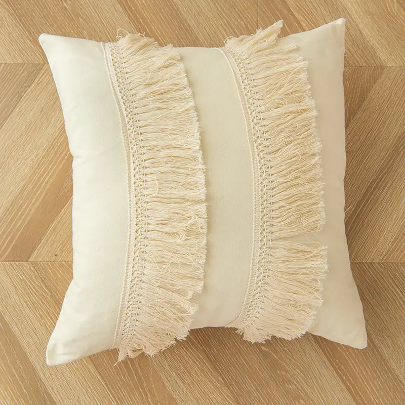 Square cream morocco style home throw pillow with fringe, perfect for a playful throw accent