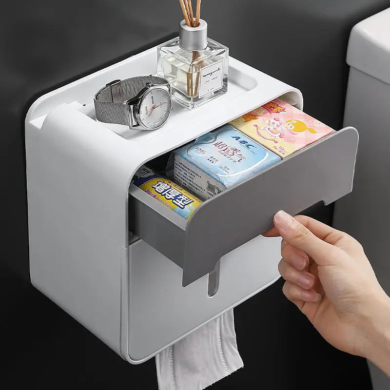 Wall-mounted tissue box with storage.