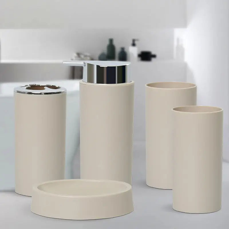 Beige bathroom accessory set.