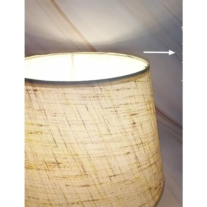 Illuminated fabric lampshade.