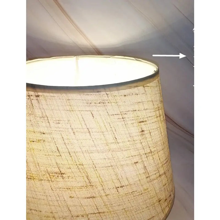 Illuminated fabric lampshade.