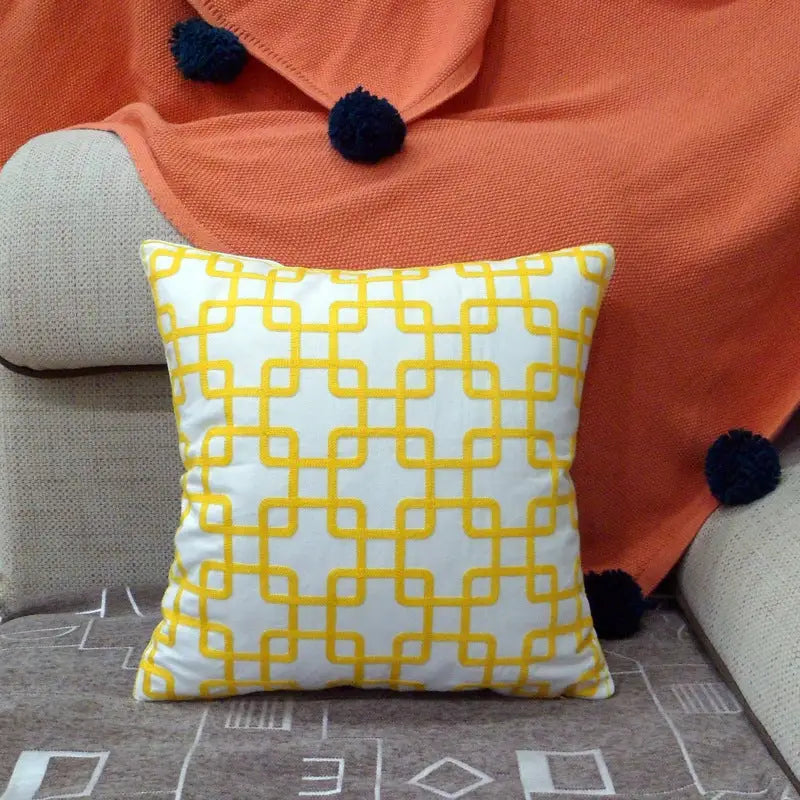 Yellow geometric patterned pillow.