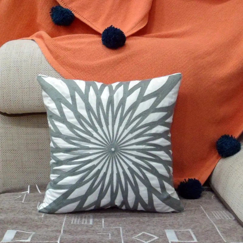 Gray and white patterned pillow.
