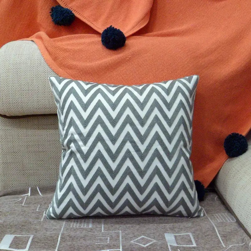 Gray and white chevron pillow.