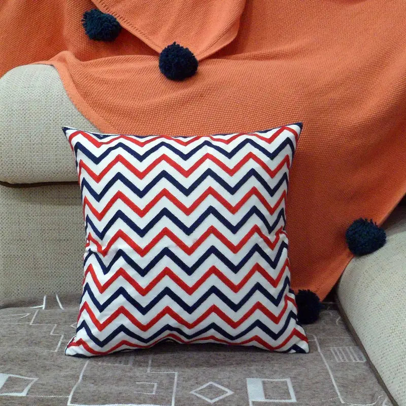 Chevron-patterned decorative pillow.