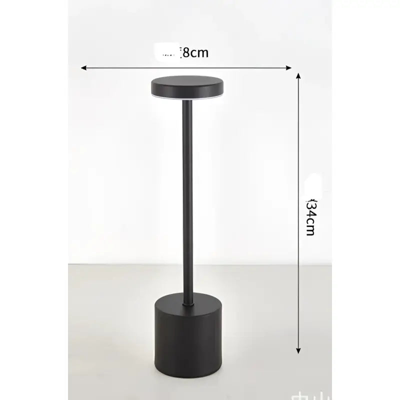 Black cylindrical table lamp.