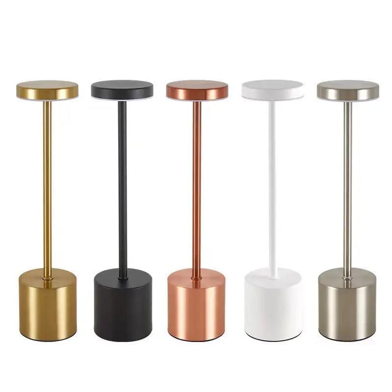 Five cylindrical table lamps.